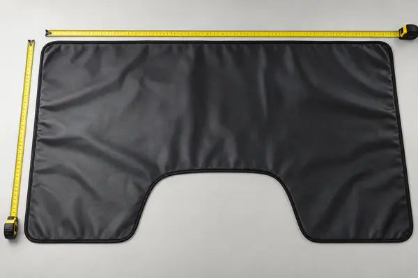 Reusable automotive fender cover laid flat for finished dimension inspection