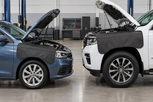 Automotive fender cover size comparison on a passenger car and a larger SUV
